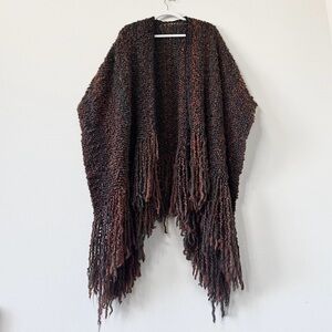 Handwoven cape with fringed edges